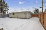 This property features a detached garage, perfect for parking or extra storage.