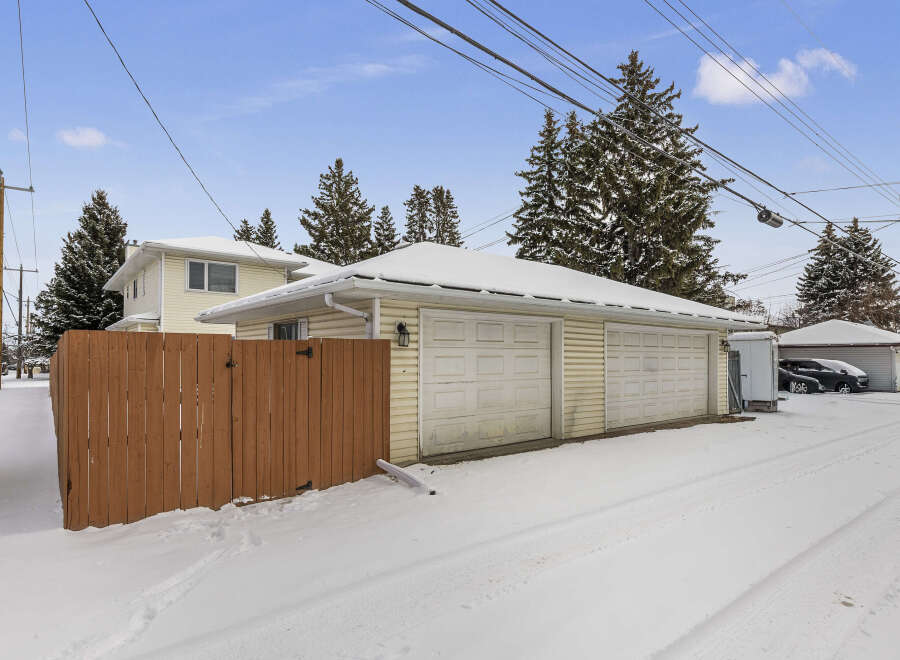 This charming property features a detached garage with ample space for vehicles and storage.