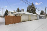 This charming property features a detached garage with ample space for vehicles and storage.