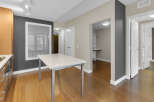Step into modern elegance with this stunning property, featuring a sleek, white-topped table perfect for dining or work.