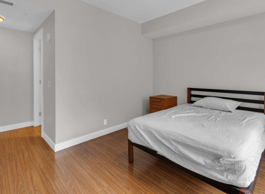 This cozy bedroom offers a comfortable retreat with its inviting ambiance.