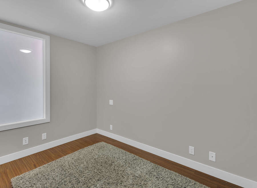 This cozy room offers a blank canvas for your design dreams.