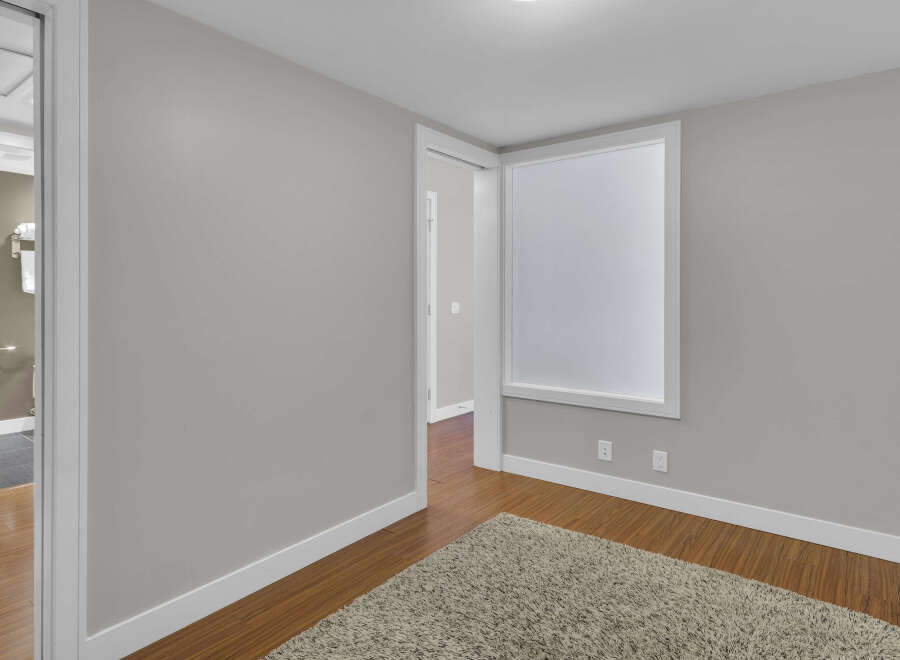 Step into this inviting space, featuring a neutral color palette and ample natural light.