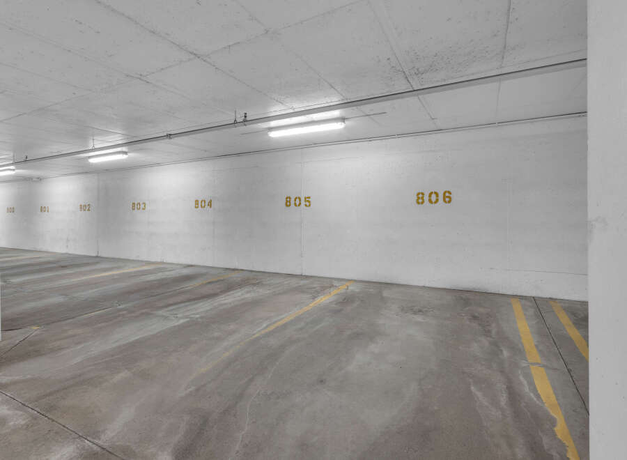 Explore the convenience of this well-lit parking garage, offering secure and designated parking spaces.