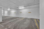 Explore the convenience of this well-lit parking garage, offering secure and designated parking spaces.