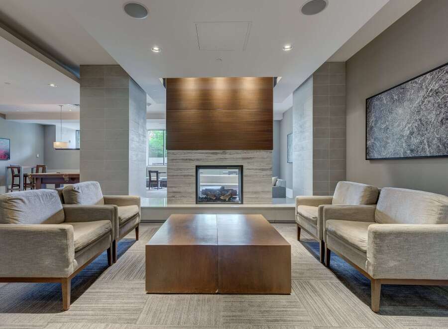 Experience luxury living in this stunning property featuring a modern fireplace, perfect for cozy evenings.