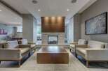 Experience luxury living in this stunning property featuring a modern fireplace, perfect for cozy evenings.