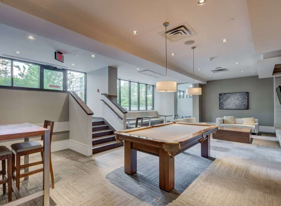 This stunning property boasts a modern game room, perfect for entertaining.