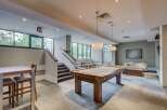 This stunning property boasts a modern game room, perfect for entertaining.