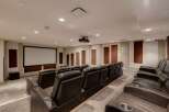 Step into luxury with this home theater! Featuring plush, leather seating and a large screen, it's perfect for movie nights.