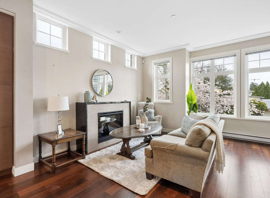 This stunning living room boasts a cozy fireplace, perfect for those chilly evenings.