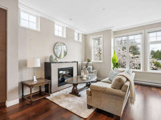This stunning living room boasts a cozy fireplace, perfect for those chilly evenings.
