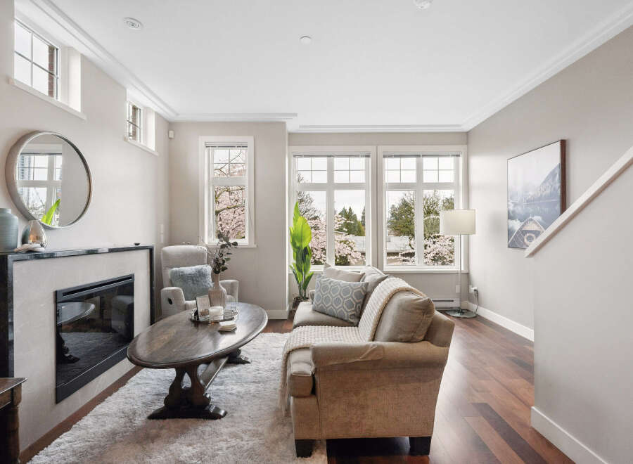 This stunning living room boasts a cozy fireplace, perfect for those chilly evenings.