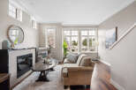 This stunning living room boasts a cozy fireplace, perfect for those chilly evenings.
