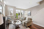 This stunning living room boasts a bright and airy atmosphere, perfect for relaxation and entertaining.