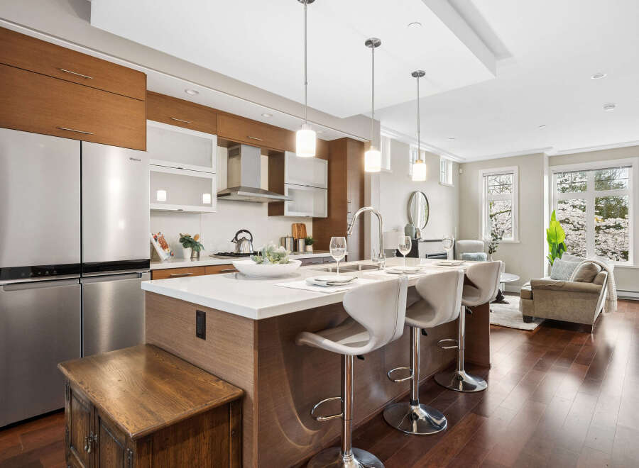 This stunning kitchen boasts modern design with stainless steel appliances and sleek cabinetry.