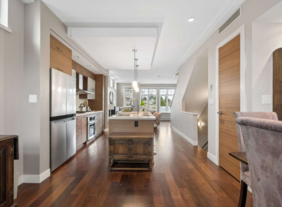This stunning property boasts a modern kitchen with stainless steel appliances and ample cabinet space.
