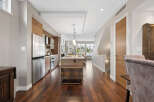 This stunning property boasts a modern kitchen with stainless steel appliances and ample cabinet space.