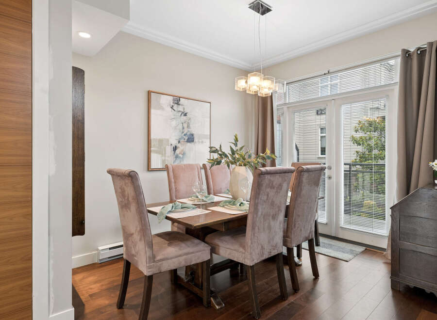 This elegant dining room features a stylish dining table with comfortable upholstered chairs, perfect for hosting dinner parties.