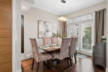 This elegant dining room features a stylish dining table with comfortable upholstered chairs, perfect for hosting dinner parties.