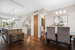 Step into luxury with this stunning property, featuring a modern kitchen island and elegant dining area.