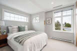 This stunning bedroom boasts a bright and airy ambiance, perfect for relaxation.