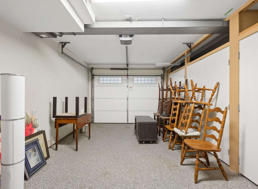 This spacious garage offers ample storage space and a clean, organized environment.