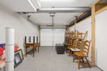 This spacious garage offers ample storage space and a clean, organized environment.