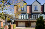 Discover modern living in this stunning townhome, featuring a stylish exterior with brick and siding.
