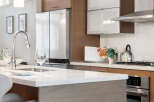 This modern kitchen boasts sleek design and high-end appliances, perfect for culinary enthusiasts.