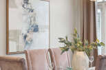 Elegant dining room showcasing a stylish table setting.