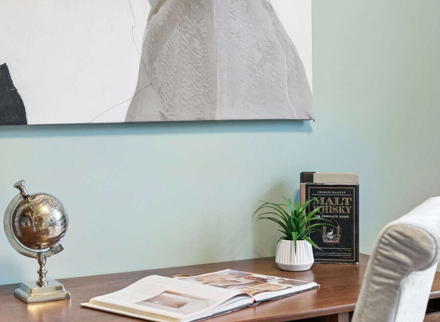 This inviting workspace features a stylish desk, perfect for work or study.