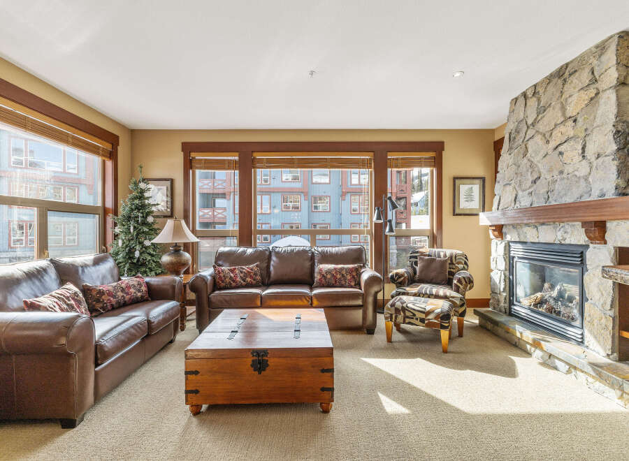 This stunning living room boasts a cozy fireplace, perfect for chilly evenings.