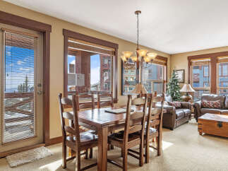 This stunning property boasts a cozy dining area, perfect for intimate gatherings.