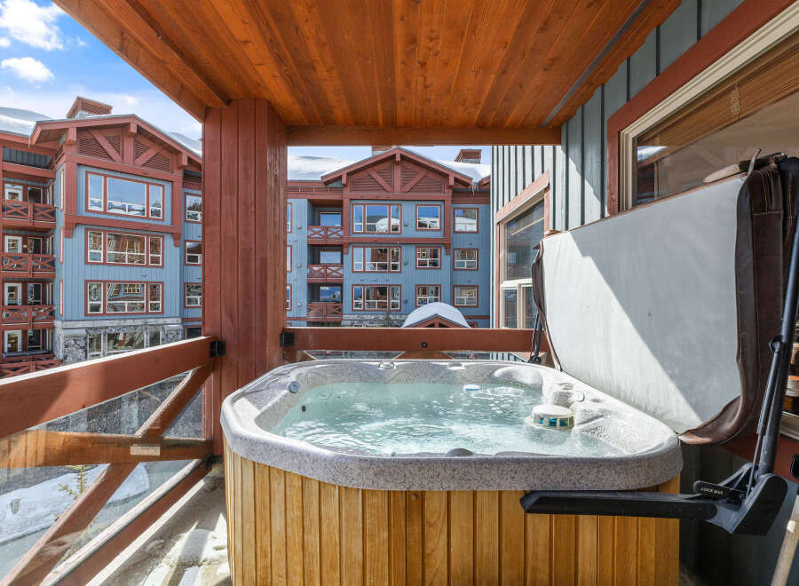 Enjoy luxurious relaxation in this stunning property featuring a private hot tub with breathtaking mountain views.