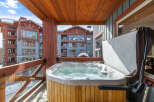 Enjoy luxurious relaxation in this stunning property featuring a private hot tub with breathtaking mountain views.
