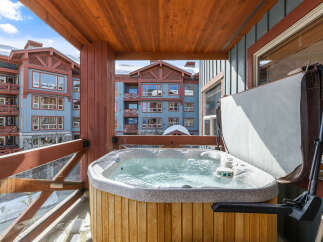 Enjoy luxurious relaxation in this stunning property featuring a private hot tub with breathtaking mountain views.