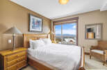 Experience the ultimate comfort in this cozy bedroom, featuring a plush bed and a stunning view.