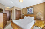 This inviting bedroom features a cozy bed, perfect for a relaxing retreat.