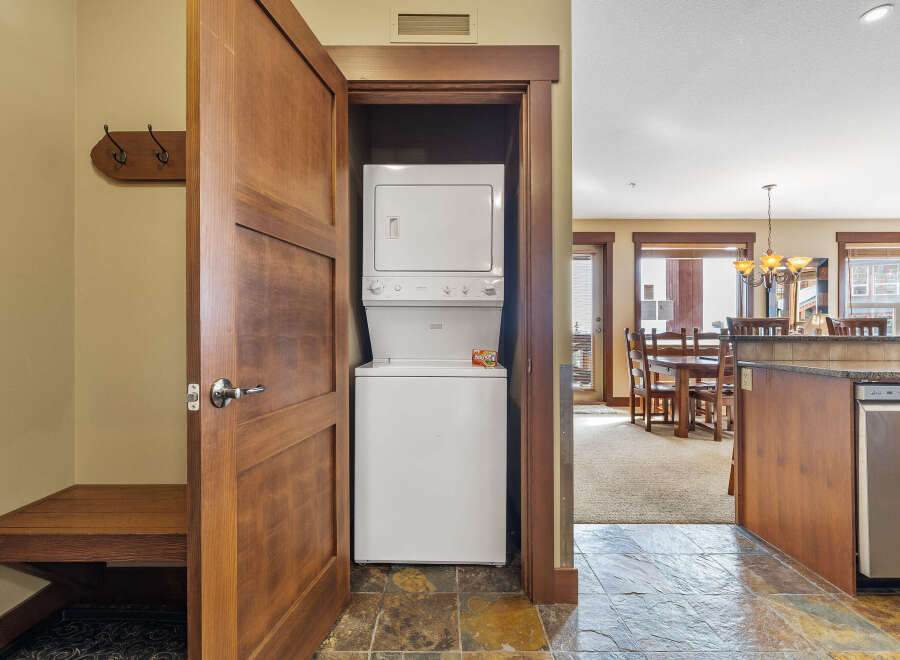 Step into this beautifully designed property and discover a convenient laundry area with a stacked washer and dryer.