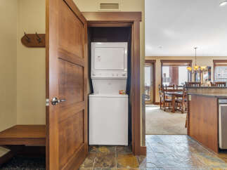 Step into this beautifully designed property and discover a convenient laundry area with a stacked washer and dryer.