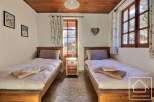 This charming bedroom features two single beds, perfect for a cozy stay.