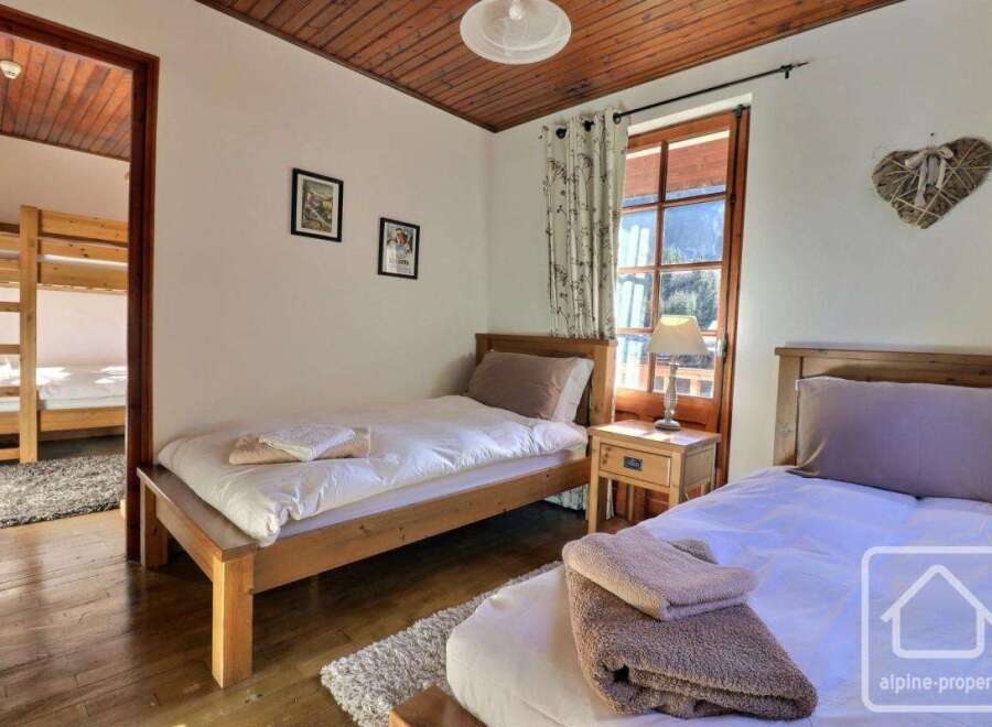 This charming bedroom features two single beds, perfect for a cozy stay.