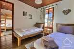 This charming bedroom features two single beds, perfect for a cozy stay.