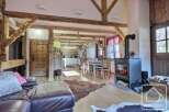 Experience rustic charm in this stunning property! Featuring exposed wooden beams, a cozy fireplace, and a spacious layout, this home offers a warm and inviting atmosphere.