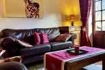 Experience the charm of this cozy living space, perfect for relaxation and entertaining.
