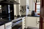 Discover the charm of this well-equipped kitchen, perfect for culinary enthusiasts.
