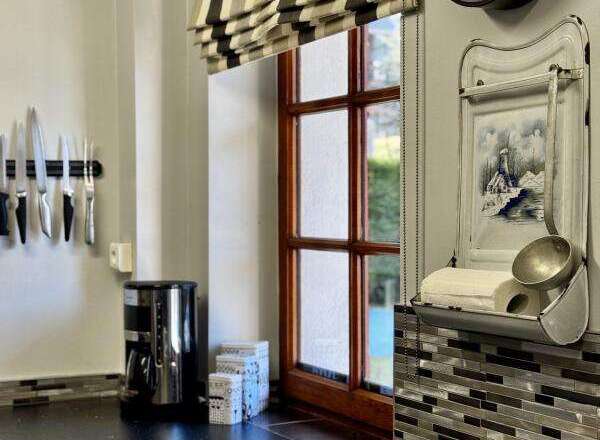 This charming kitchen features a stylish design with a modern touch.