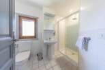 This charming bathroom features a bright and airy design, perfect for a relaxing retreat.