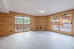 This stunning property boasts a bright and airy interior, featuring beautiful wooden walls and large windows that offer breathtaking views.